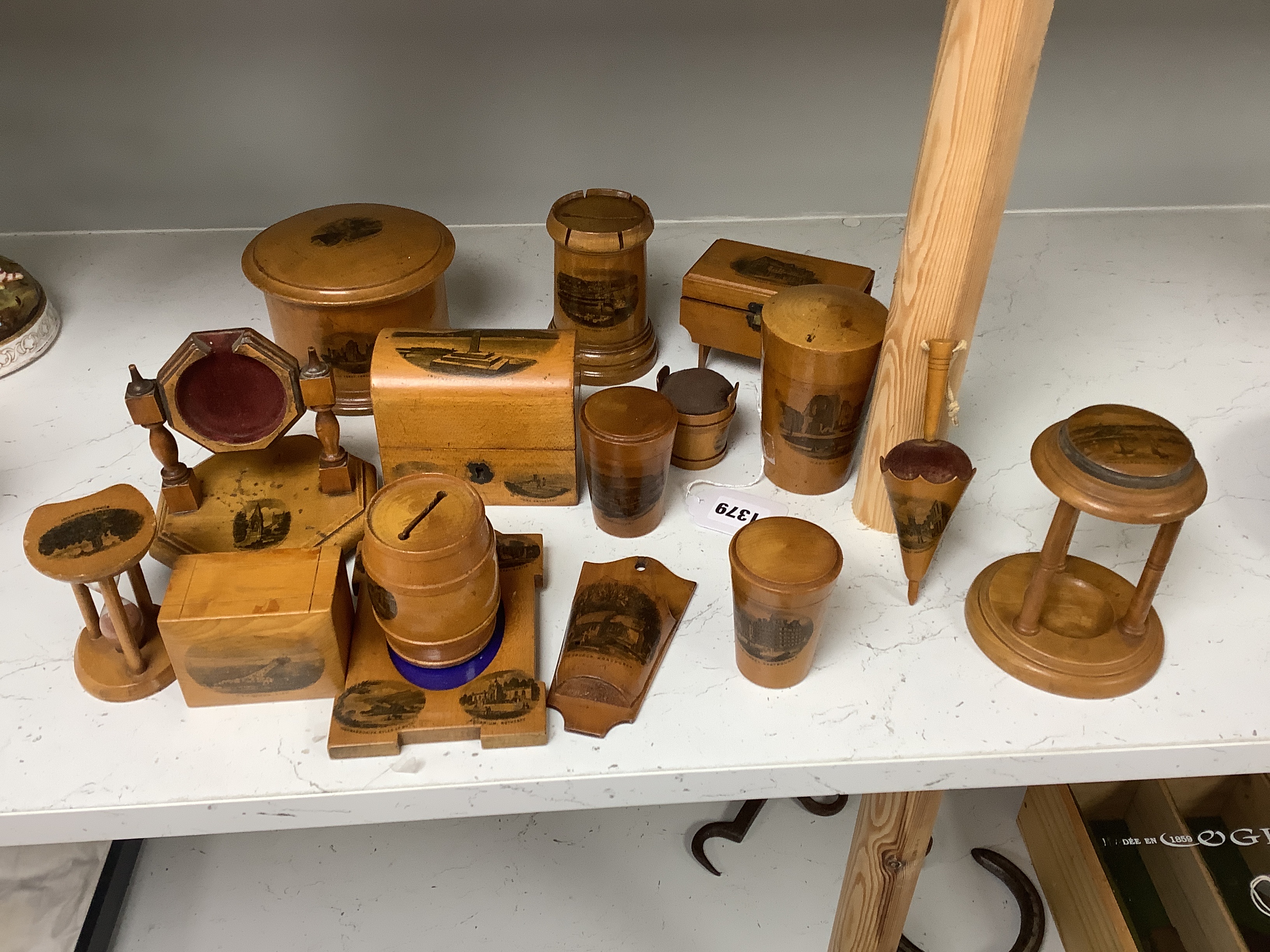 Sixteen mixed Mauchline ware boxes, pin cushions, pots, and a frame etc, tallest 13.5cm high